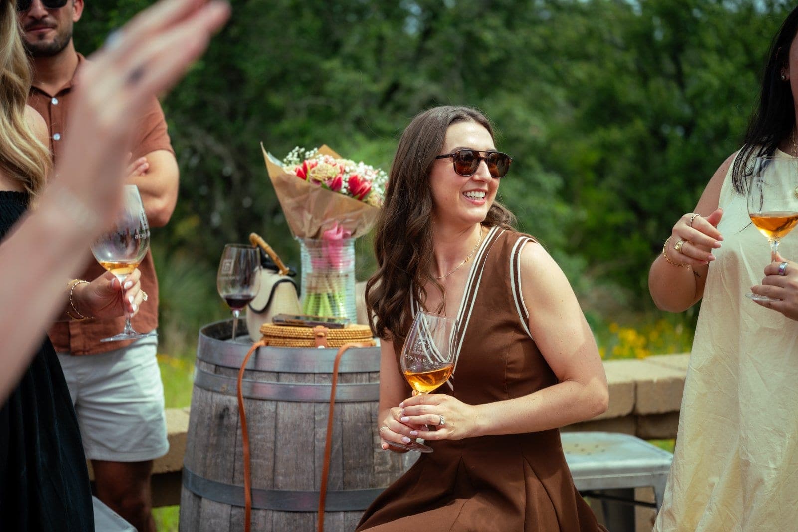 Joyful proposal celebration with friends and family during an Austin proposal photography session.