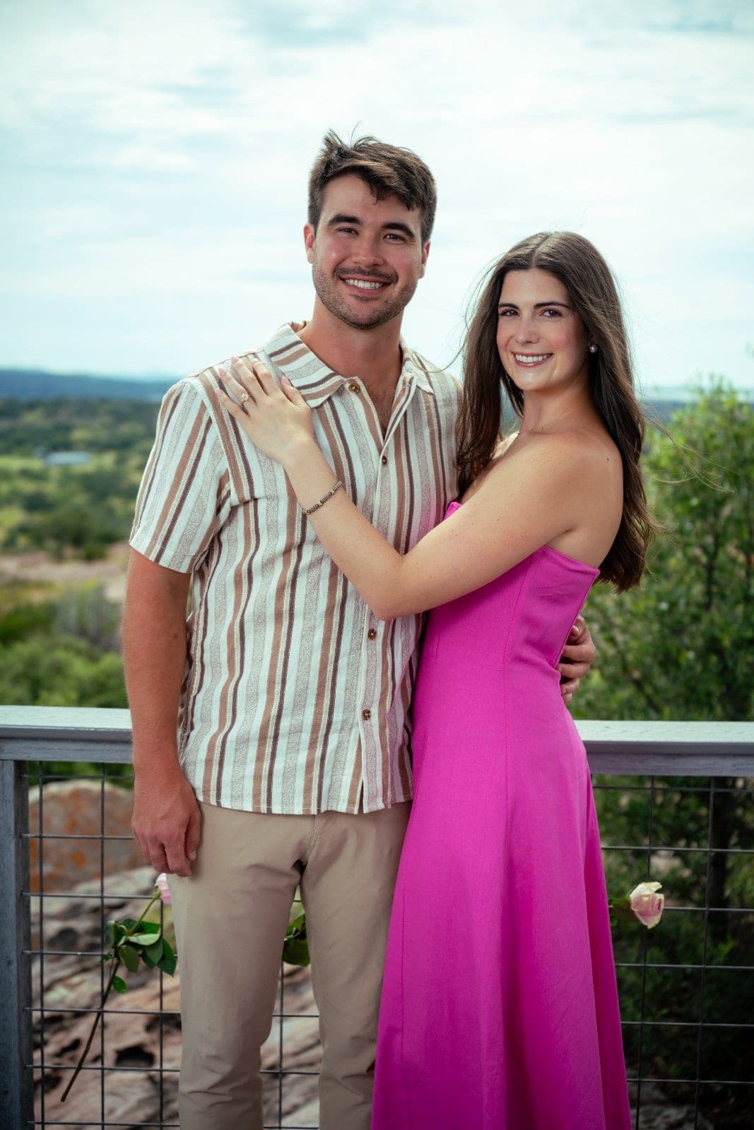 Engaged couple posing together after a surprise proposal in Austin, Texas, photographed by Zan Visuals.