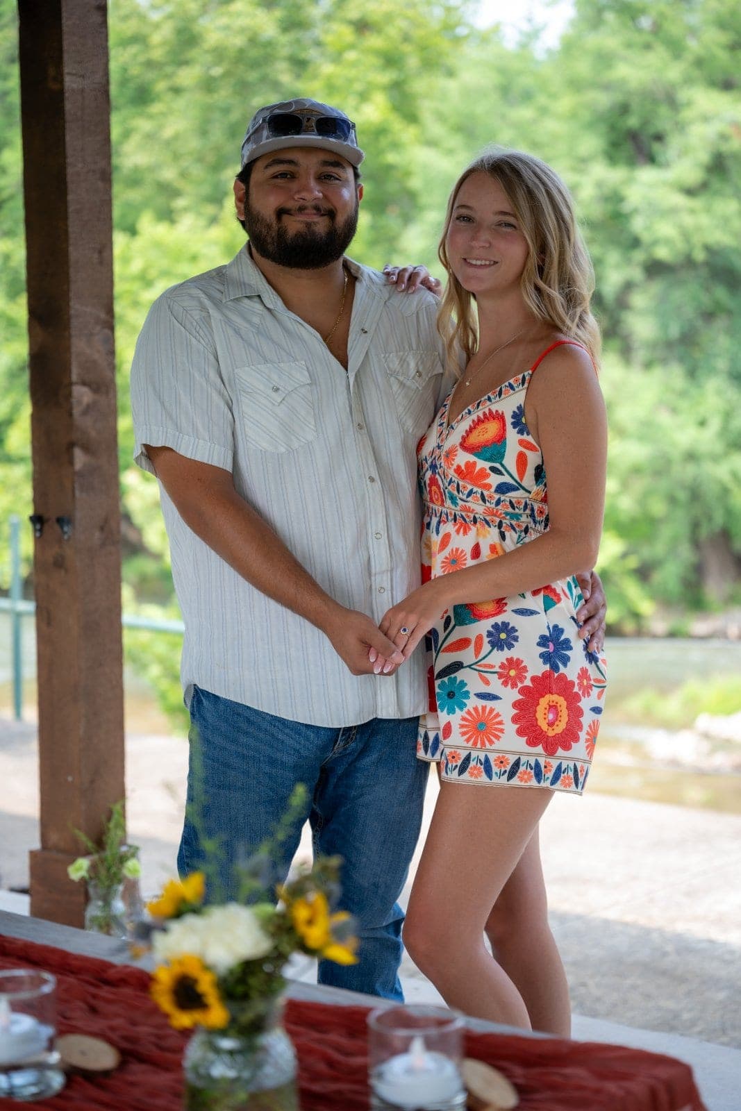 Newly engaged couple holding hands after a romantic proposal session in Austin, Texas.