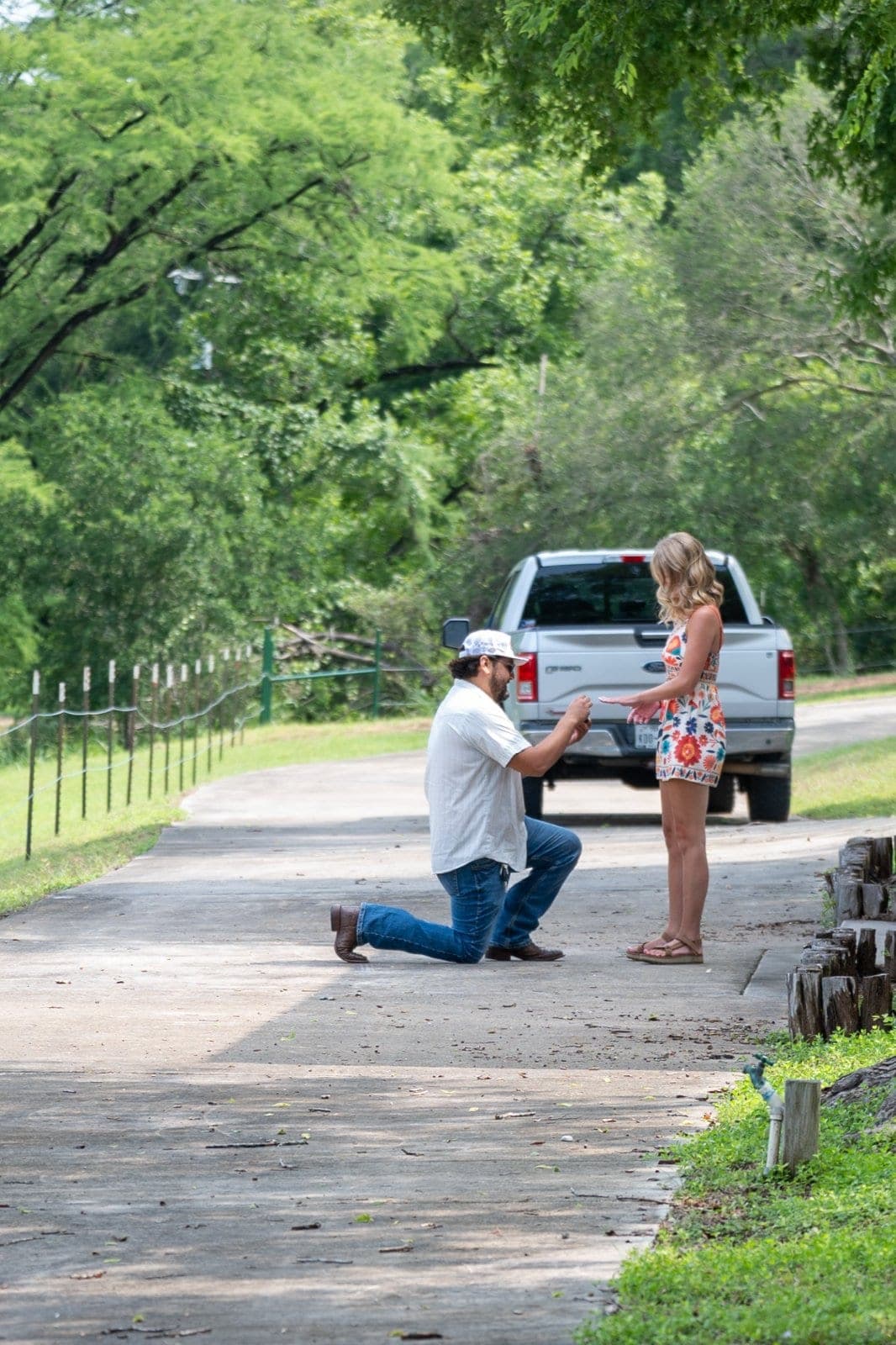 Man proposing on one knee during a surprise proposal session in Austin, Texas, captured by Zan Visuals.