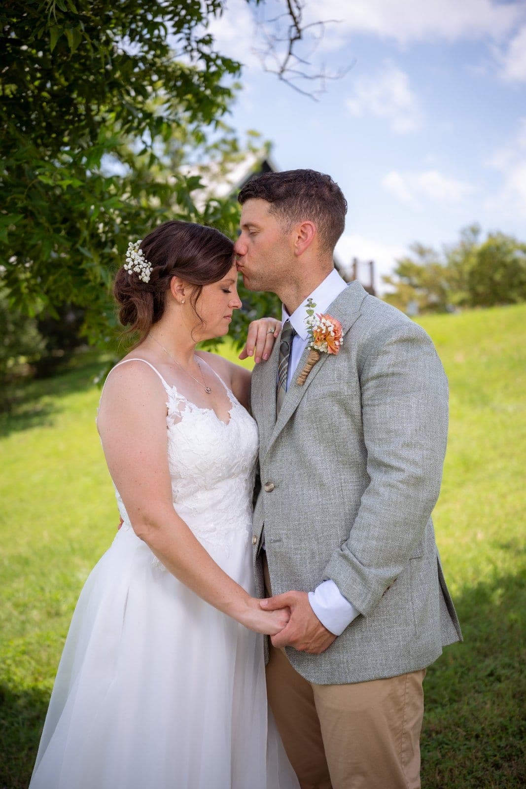 Bride and groom sharing a tender moment outdoors during their Austin, Texas wedding.